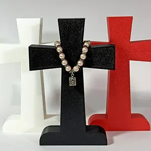 Collection of resin crosses showing available colors in white, black, purple, brown, and red.